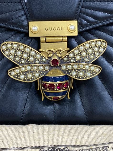 gucci linea quilted leather bee clutch bag|gucci bee bag.